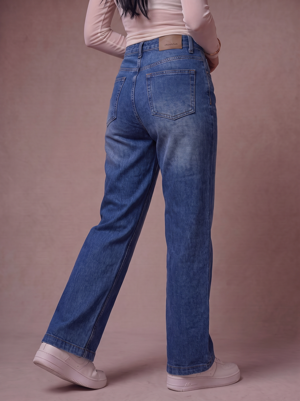 The Classic Straight — back view, waist to feet, vintage indigo wash
