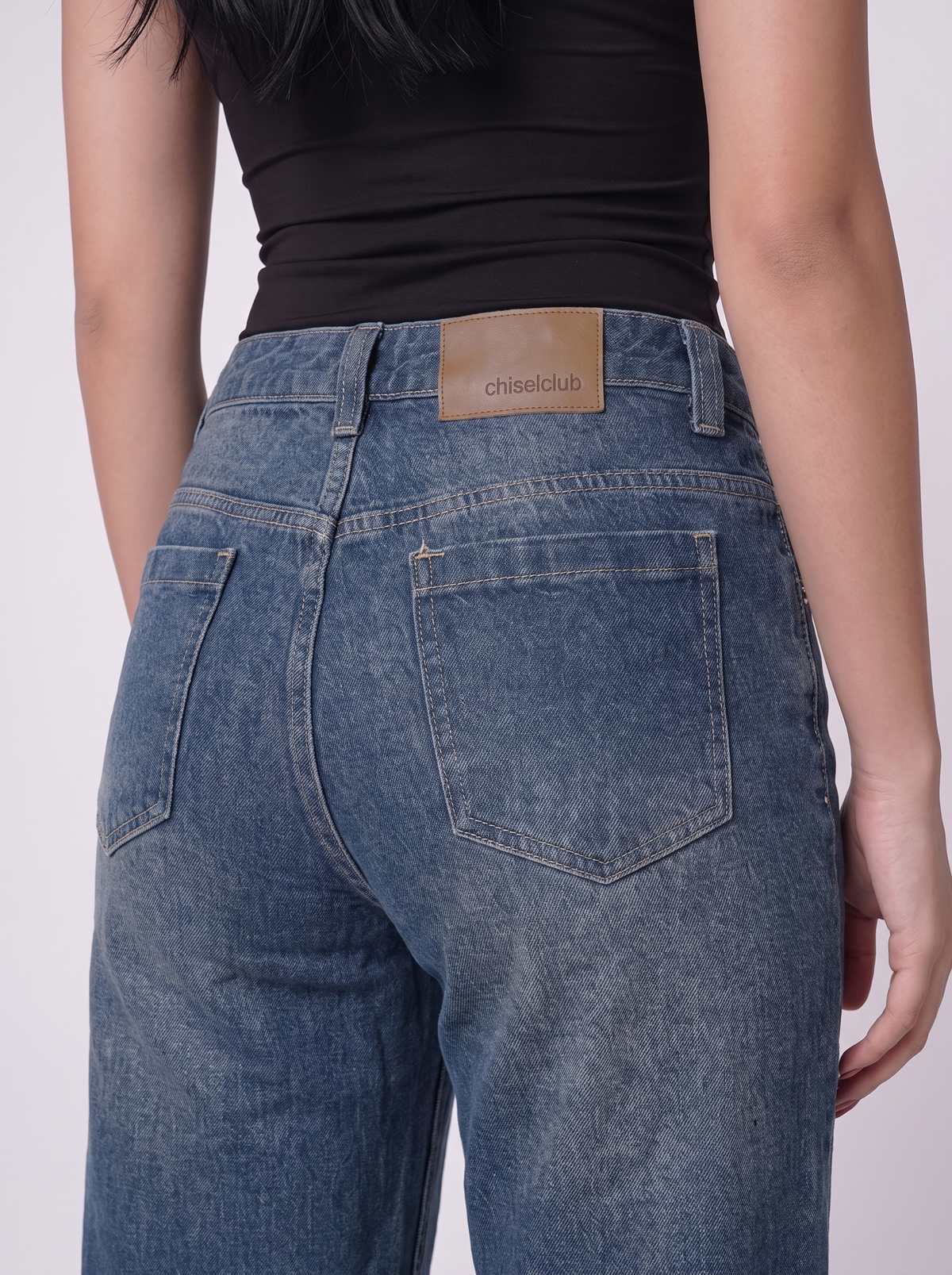 The Relaxed Wide — close-up detail, vintage indigo wash