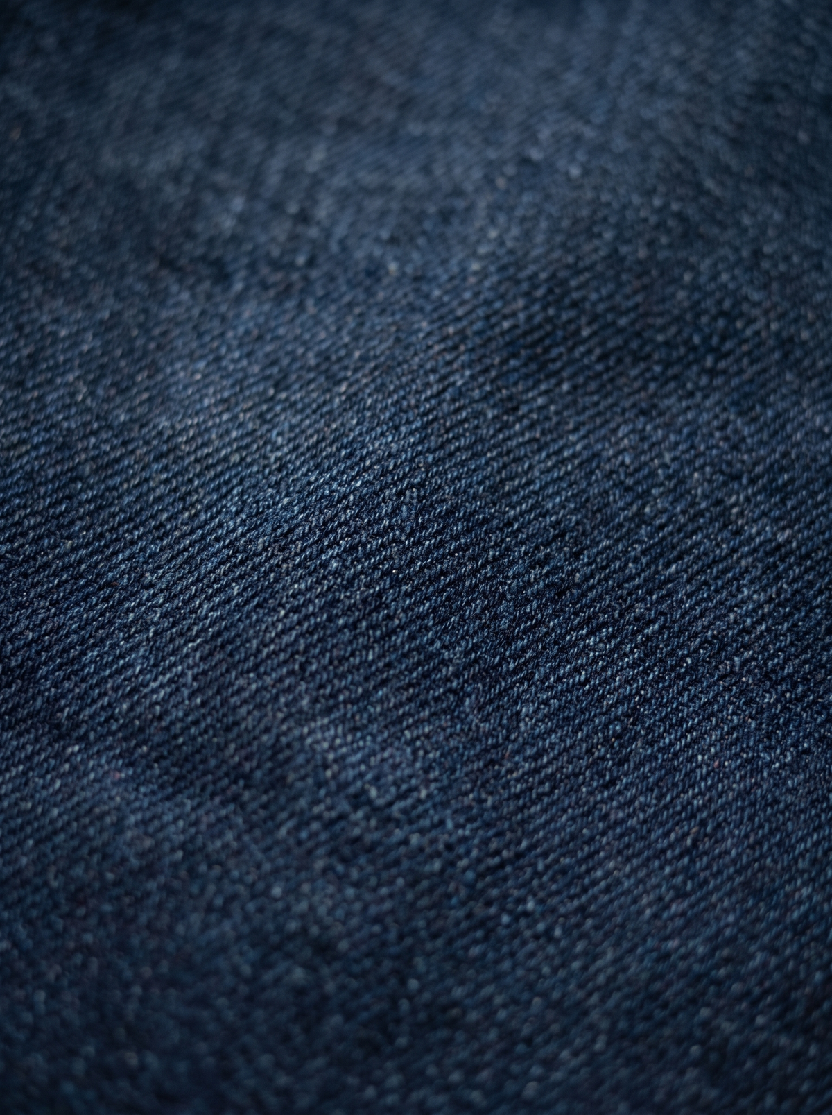The Raw Indigo Flare — close-up detail, deep raw unwashed indigo