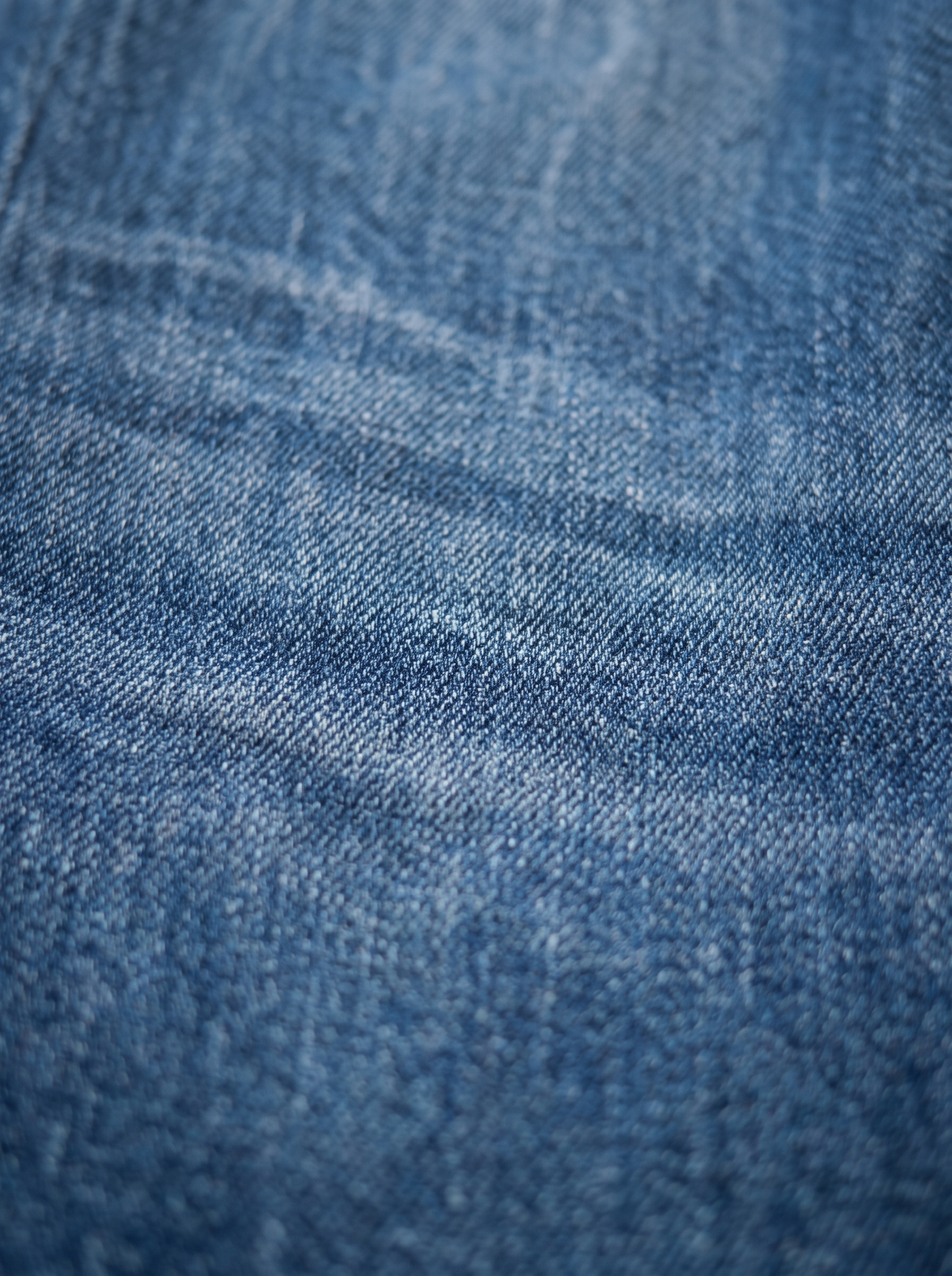 The Vintage Indigo Straight — fabric texture macro, vintage-tinted dark indigo weave