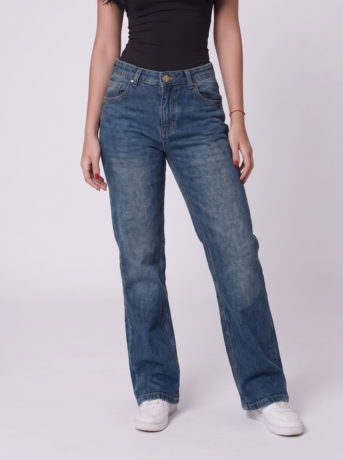 The Relaxed Wide — editorial full body, warm studio backdrop