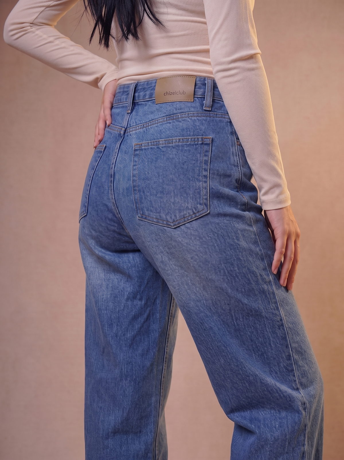 The Wide Raw — back view, waist to feet, vintage indigo wash