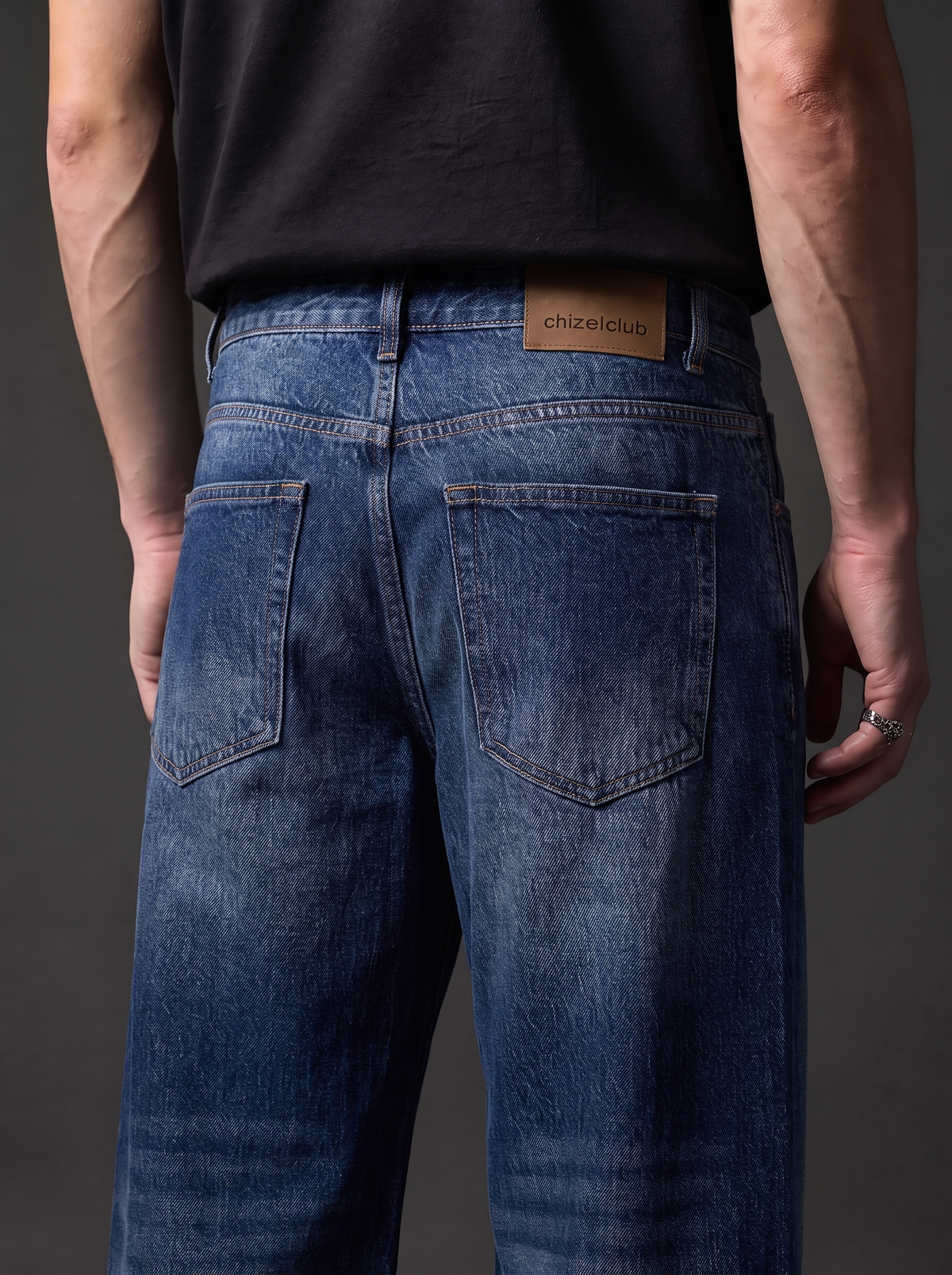 The Classic Indigo Wide — back close-up showing chizelclub leather patch