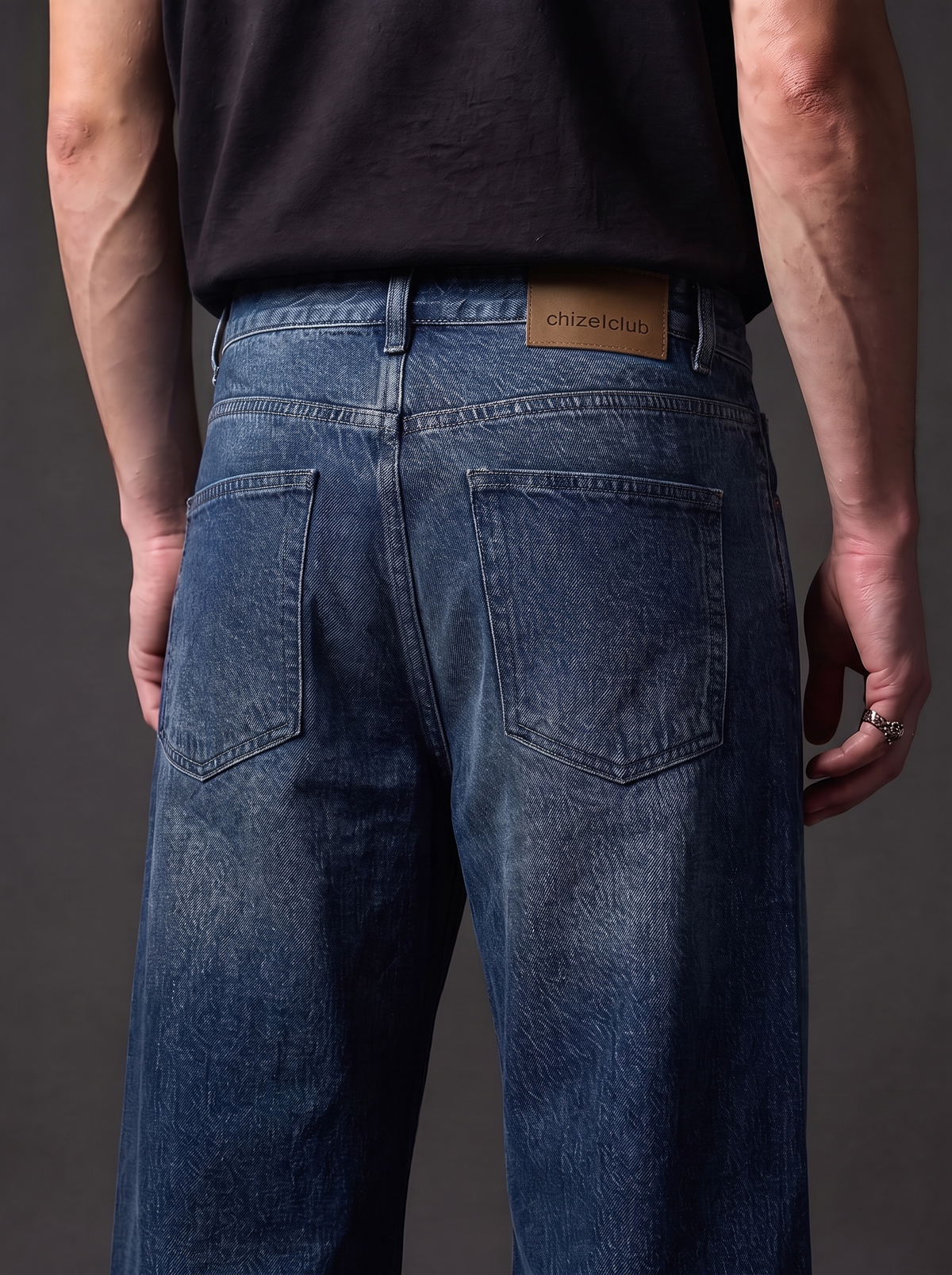 The Vintage Indigo Straight — back close-up showing chizelclub leather patch