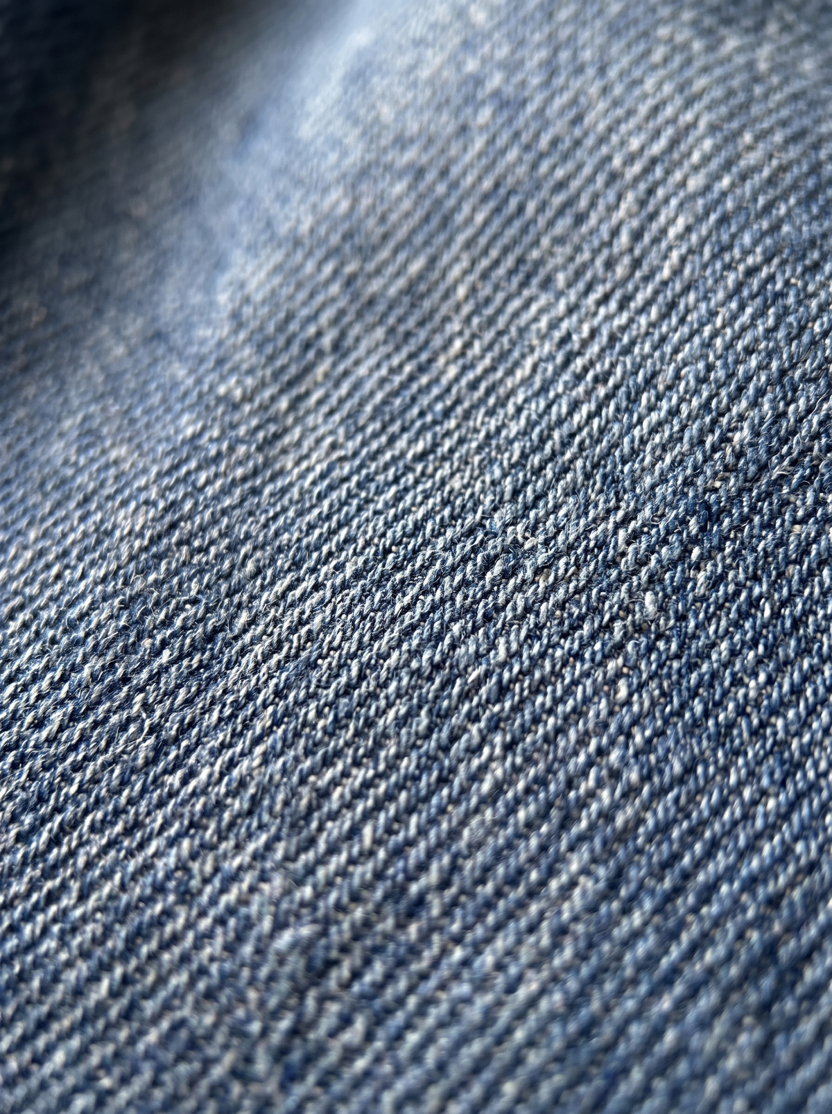 The Classic Indigo Wide — fabric texture macro, mid-indigo cotton denim weave